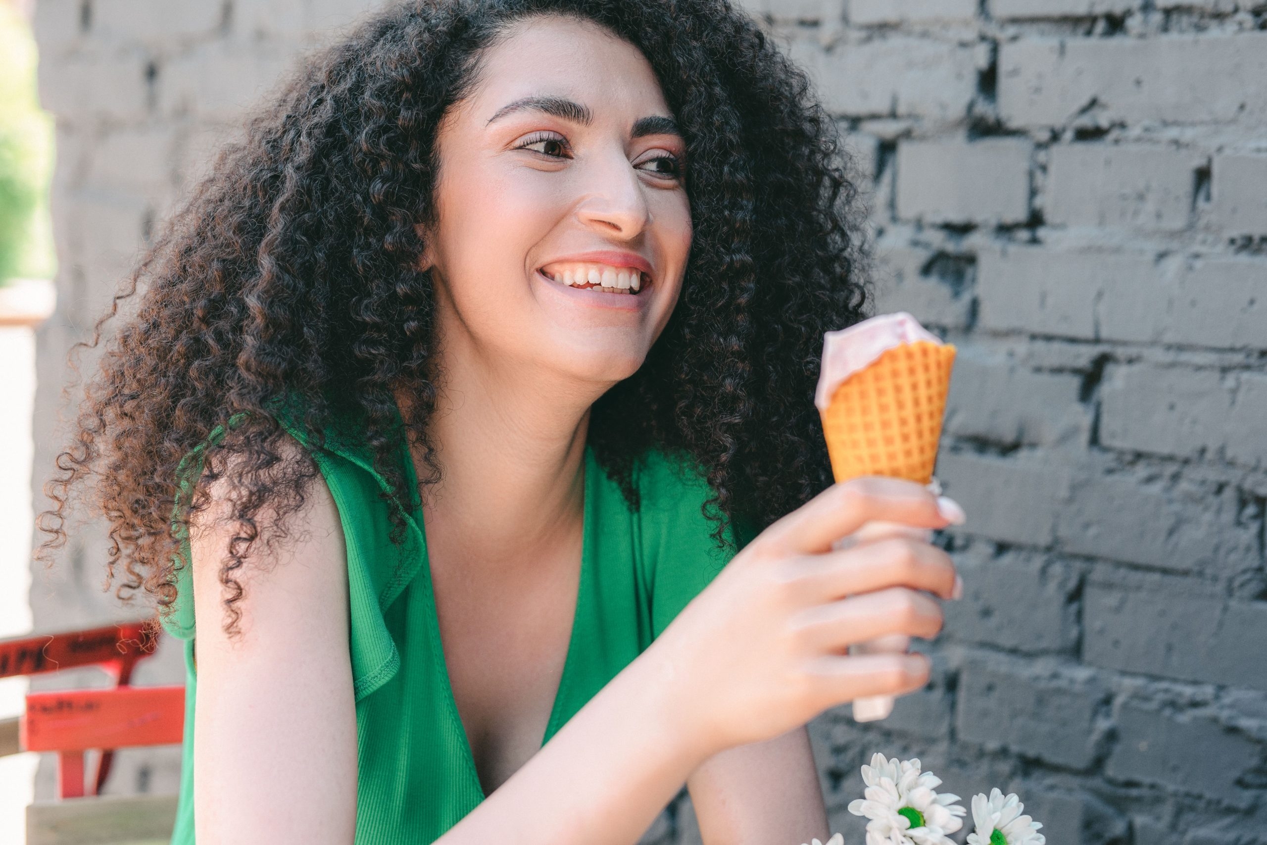 Lady with ice cream and sensitive teeth